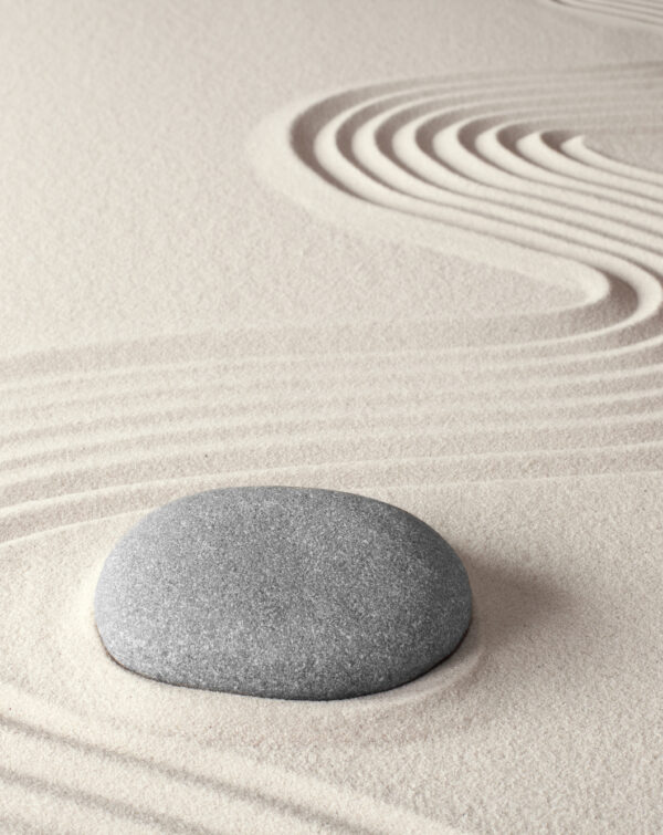 spiritual zen meditation background in Japanese rock garden concept for harmony balance simplicity sand and pebble tao or Buddhism
